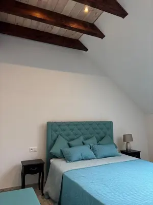 Łóżko lub łóżka w pokoju w obiekcie Agroturystyka Ajmarya apartament