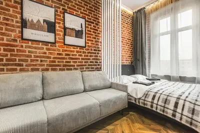 Łóżko lub łóżka w pokoju w obiekcie Wyjątkowe Miejsce w Sercu Wrocławia