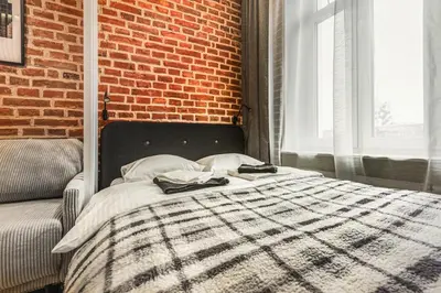 Łóżko lub łóżka w pokoju w obiekcie Wyjątkowe Miejsce w Sercu Wrocławia