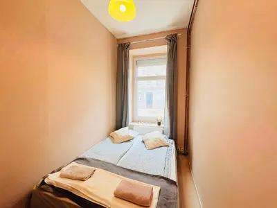 Łóżko lub łóżka w pokoju w obiekcie Brick Loft Szczęśliwa - Wrocław