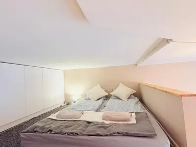 Łóżko lub łóżka w pokoju w obiekcie Brick Loft Szczęśliwa - Wrocław