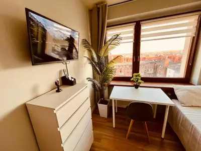 Telewizja i/lub zestaw kina domowego w obiekcie Pokoje Gliwice - apartament i komfortowe noclegi
