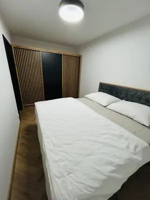 Łóżko lub łóżka w pokoju w obiekcie Apartament Bond