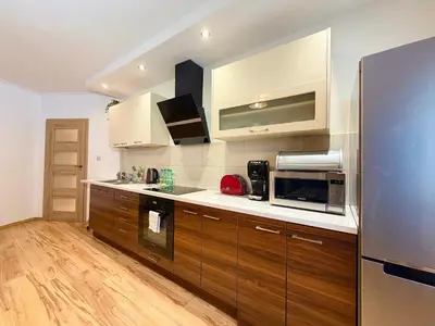 Kuchnia lub aneks kuchenny w obiekcie Rynek Wrocław Apartment for 8 People by BookingHost