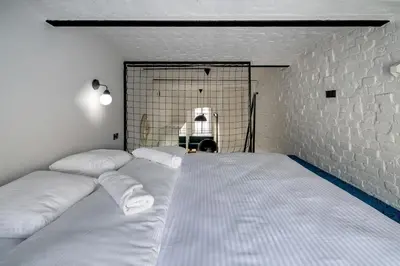 Łóżko lub łóżka w pokoju w obiekcie RentPlanet - Studio Lelewela