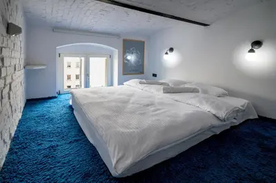 Łóżko lub łóżka w pokoju w obiekcie RentPlanet - Studio Lelewela