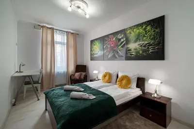Łóżko lub łóżka w pokoju w obiekcie RentPlanet - Apartament Pomorska