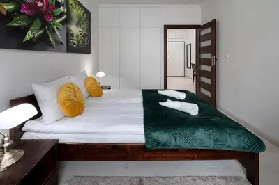 Łóżko lub łóżka w pokoju w obiekcie RentPlanet - Apartament Pomorska