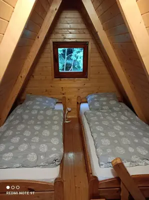 Łóżko lub łóżka w pokoju w obiekcie Zamek w Zasięgu Wzroku - Szczytna