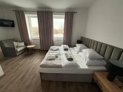 Łóżko lub łóżka w pokoju w obiekcie Hostel Granat
