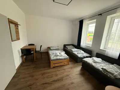 Łóżko lub łóżka w pokoju w obiekcie Hostel Granat