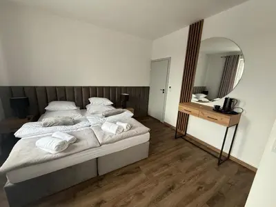 Łóżko lub łóżka w pokoju w obiekcie Hostel Granat
