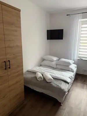 Łóżko lub łóżka w pokoju w obiekcie Hostel Granat