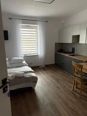 Łóżko lub łóżka w pokoju w obiekcie Hostel Granat