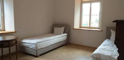 Łóżko lub łóżka w pokoju w obiekcie Villa La Pierre
