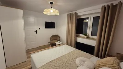 Łóżko lub łóżka w pokoju w obiekcie Hortensjowe Zacisze