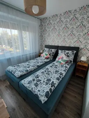 Łóżko lub łóżka w pokoju w obiekcie Apartament Prudniczanka