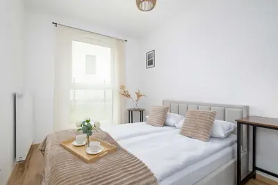 Łóżko lub łóżka w pokoju w obiekcie Elegant Apartment in Gliwice with Garden Desk and Parking by Noclegi Renters