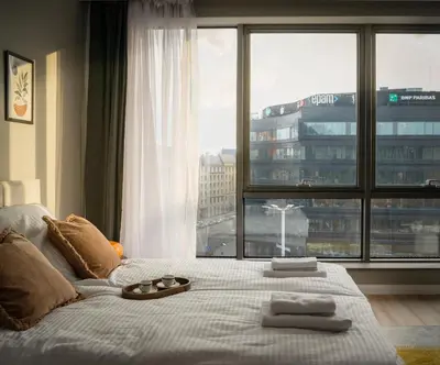 Łóżko lub łóżka w pokoju w obiekcie ProperUNIT City Center Best View Apartment with AC