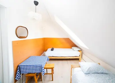 Łóżko lub łóżka w pokoju w obiekcie Hostel Jamnik
