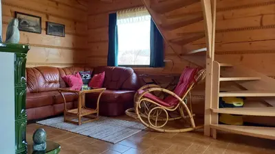 Część wypoczynkowa w obiekcie Domek jak z bajki - stylowy domek z bali z kominkiem