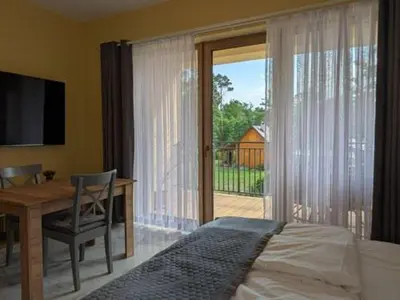 Łóżko lub łóżka w pokoju w obiekcie Apartamenty Biwakowa 4B