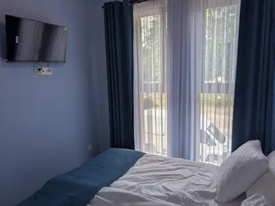 Łóżko lub łóżka w pokoju w obiekcie Apartamenty Biwakowa 4B