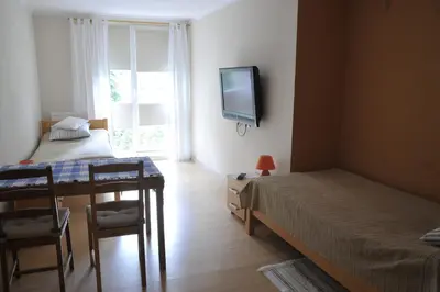 Łóżko lub łóżka w pokoju w obiekcie Wood Creek Apartments