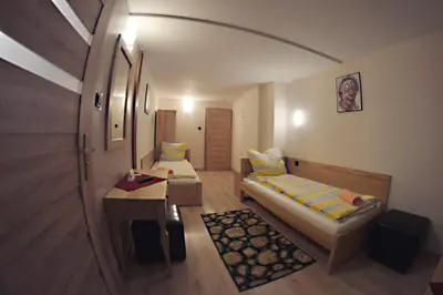 Łóżko lub łóżka w pokoju w obiekcie Pensjonat Lido