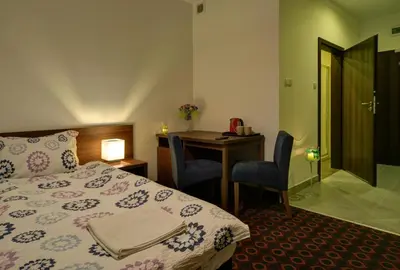 Łóżko lub łóżka w pokoju w obiekcie Browar Miedzianka