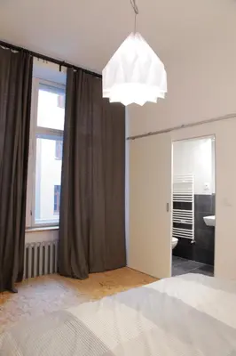 Łóżko lub łóżka w pokoju w obiekcie Apartment Rzeznicza