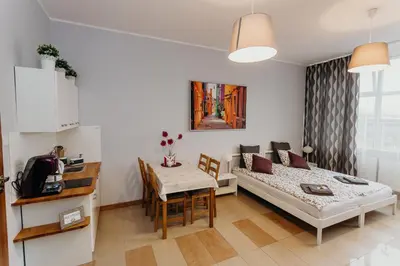 Łóżko lub łóżka w pokoju w obiekcie Grey Apartments II