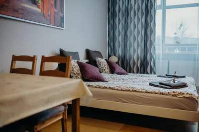 Łóżko lub łóżka w pokoju w obiekcie Grey Apartments II