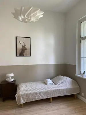 Łóżko lub łóżka w pokoju w obiekcie Apartament Parkowy w Polanicy Zdrój