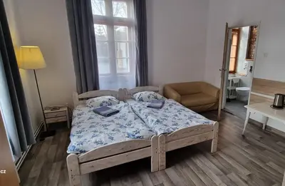 Łóżko lub łóżka w pokoju w obiekcie Ośrodek Wypoczynkowy Radosno