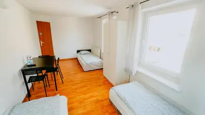 Łóżko lub łóżka w pokoju w obiekcie Noclegi WOKU