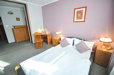 Łóżko lub łóżka w pokoju w obiekcie Hotel Trzy Światy Spa & Wellness Rajska WySpa