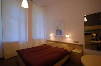 Łóżko lub łóżka w pokoju w obiekcie Platinium Centrum