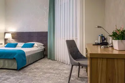 Łóżko lub łóżka w pokoju w obiekcie Tulip Hotels - Wroclaw Patio