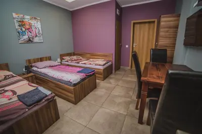 Łóżko lub łóżka w pokoju w obiekcie Noclegi Andersa