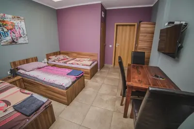 Łóżko lub łóżka w pokoju w obiekcie Noclegi Andersa
