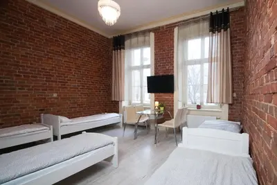 Łóżko lub łóżka w pokoju w obiekcie Vanilla Hostel Wrocław