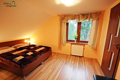 Łóżko lub łóżka w pokoju w obiekcie Dom na wzgórzu