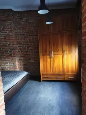 Łóżko lub łóżka w pokoju w obiekcie Apartamenty Młyńska 4