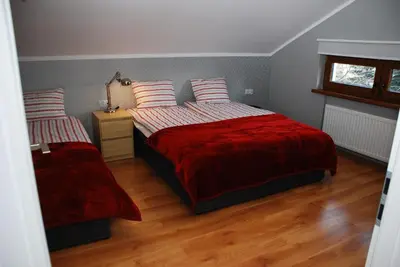 Łóżko lub łóżka w pokoju w obiekcie Apartamenty Akacjowa przy Parku Szwedzkim