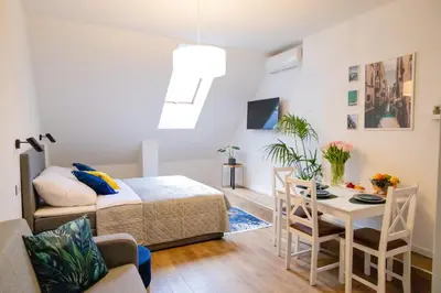 Łóżko lub łóżka w pokoju w obiekcie Galeria Italiana Apartments