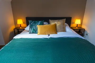 Łóżko lub łóżka w pokoju w obiekcie Galeria Italiana Apartments