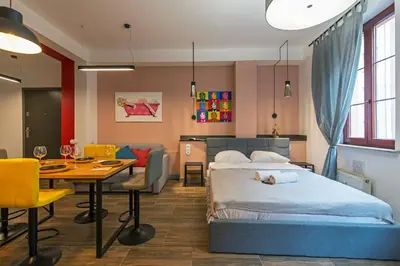 Łóżko lub łóżka w pokoju w obiekcie Galeria Italiana Apartments