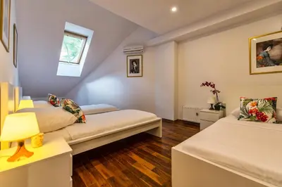 Łóżko lub łóżka w pokoju w obiekcie Galeria Italiana Apartments