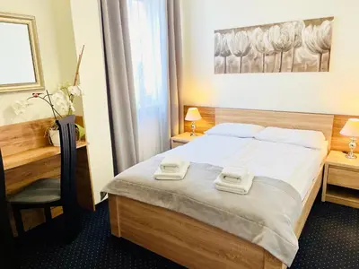 Łóżko lub łóżka w pokoju w obiekcie Hotel Seven 7